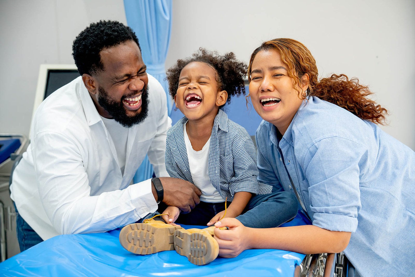 Portrait of African American father laugh with little girl and A